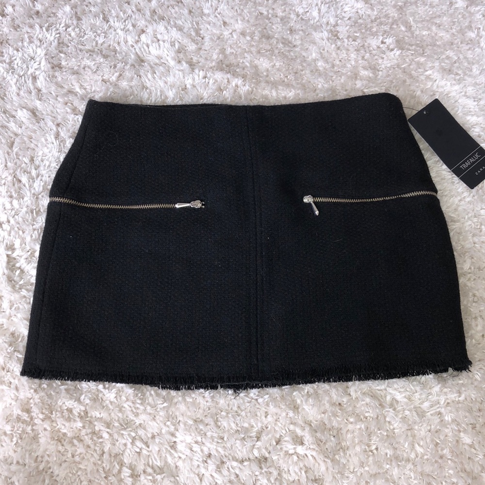 Black suede frayed black mini skirt.